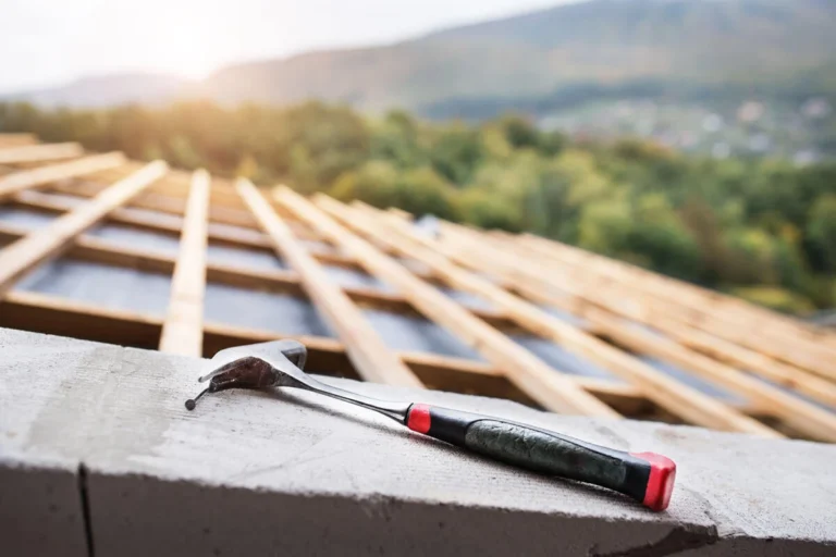 Hammer lying on a roof under construction