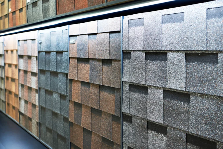 Asphalt shingle color samples in gray, brown and tan
