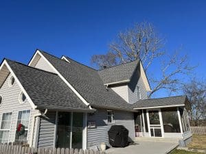 house with repaired roof in knoxville, grey roof and siding