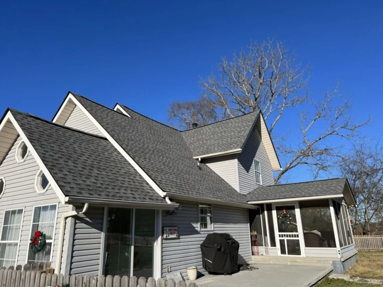 Knoxville home with a repaired gray shingle roof