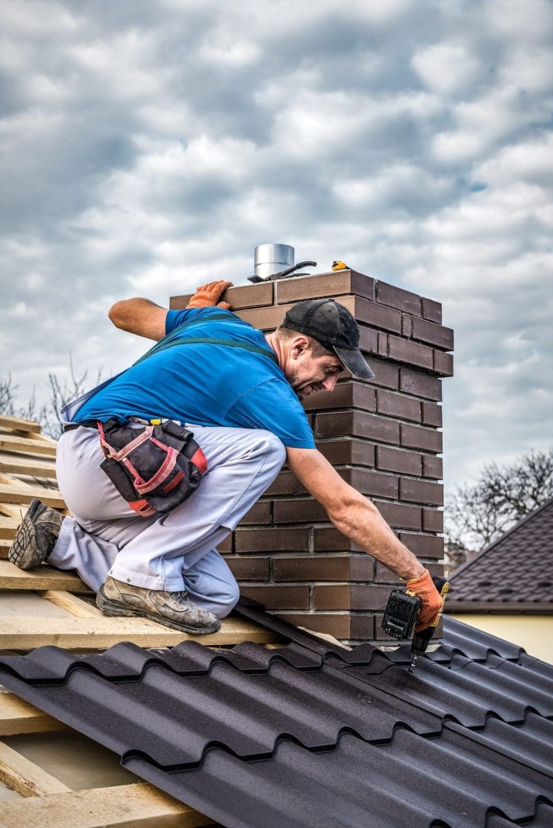 construction worker on top of roof