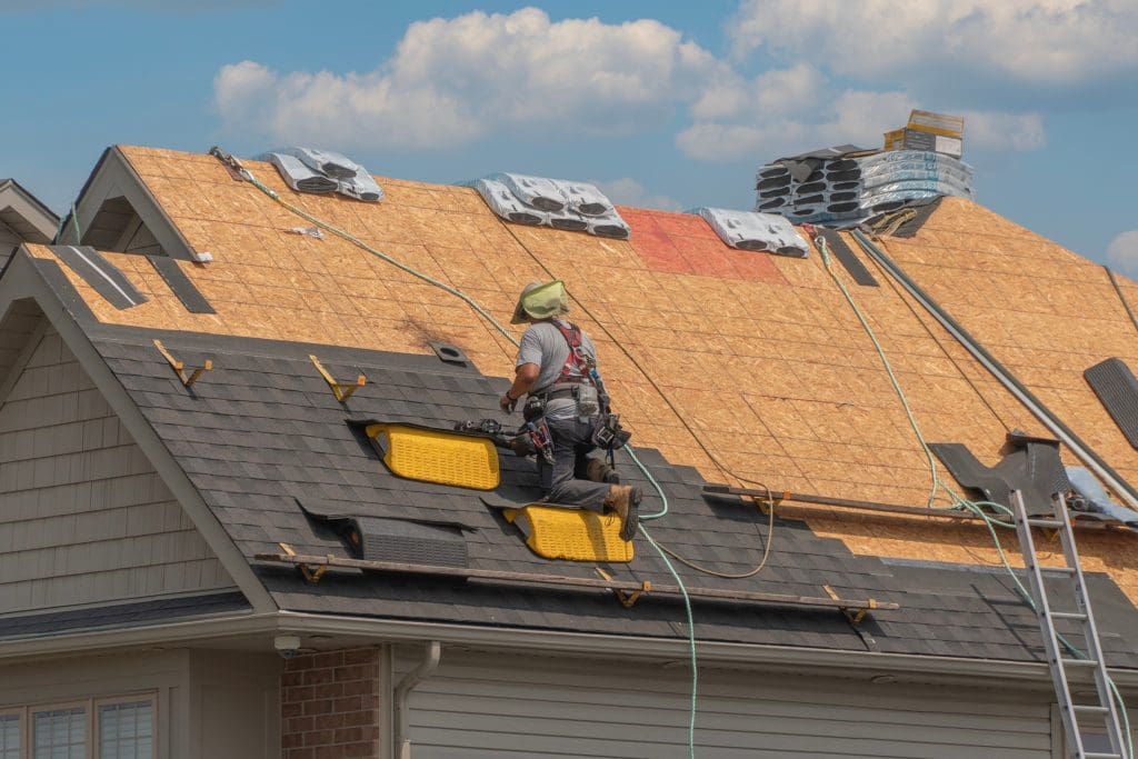 roofing contractors on top of roof