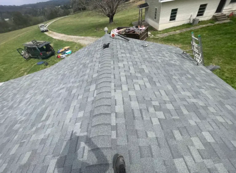 Detached garage with newly installed gray asphalt shingle roofing system