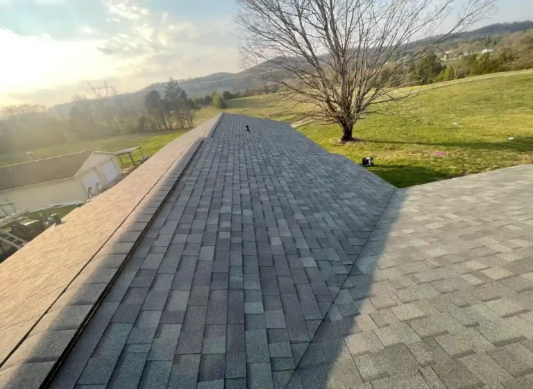 New gray asphalt shingle roof installed on rural residential property