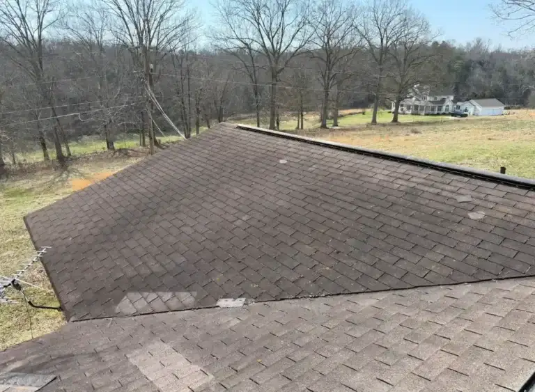 Aging asphalt shingle roof inspected for replacement due to wear and leak concerns