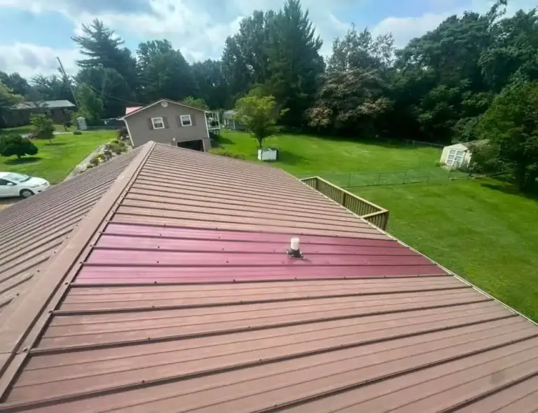 Completed metal roof repair featuring a replaced panel and new pipe boot to prevent leaks in Talbott, TN.