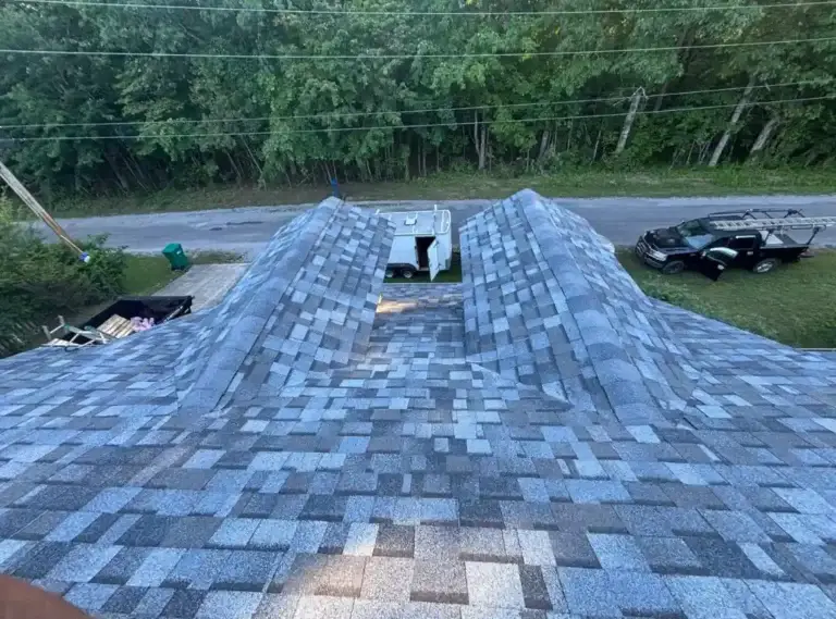 Wide view of the completed roof system featuring new architectural shingles and properly capped ridges in Crossville, TN.