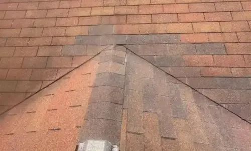 Completed roof valley repair with new shingles installed over previously damaged moisture-prone areas.