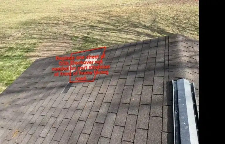 Damaged roof decking area marked for OSB replacement during residential roof replacement project