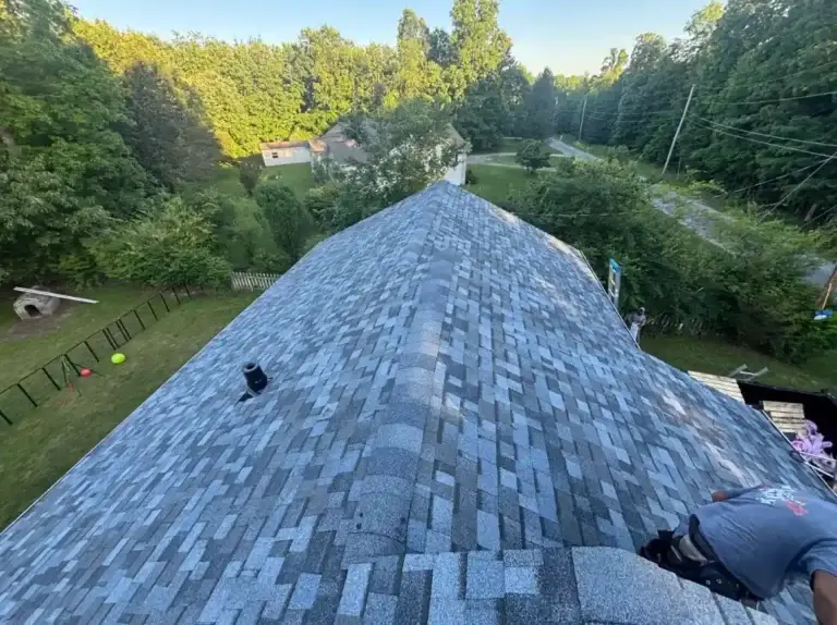 Completed asphalt shingle roof with new ridge caps installed during a residential roof replacement in Crossville, TN.