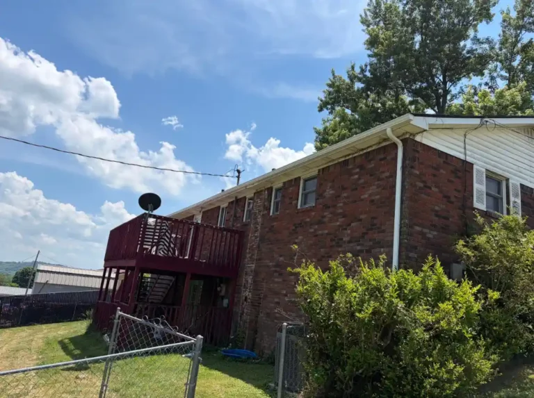 New gutter and downspout system installed during a roof replacement project by Daniel Hood Roofing.