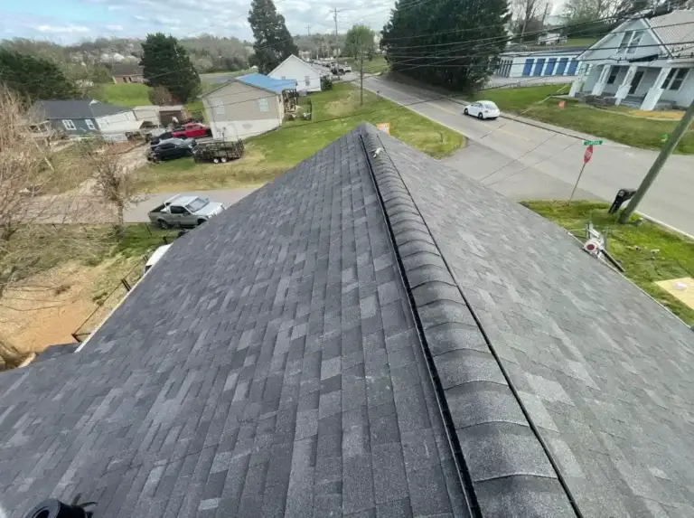 Completed asphalt shingle roof replacement with ridge vent installation on residential home
