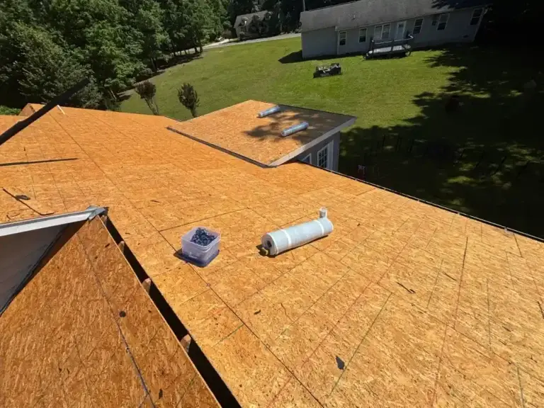 New roof decking installed on a residential home with roofing materials prepared for installation in Crossville, TN.