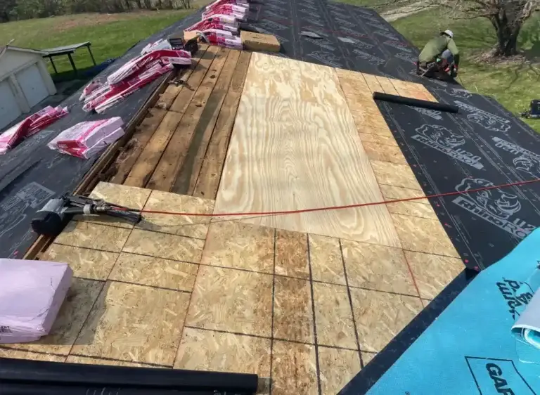Roof decking repair and RhinoRoof underlayment installation during residential roof replacement