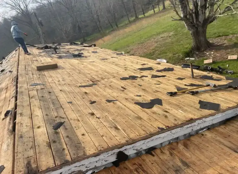 Residential roof stripped to decking in preparation for complete roof replacement