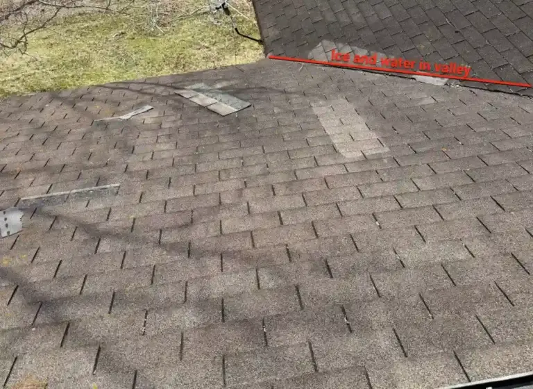 Roof valley inspection highlighting need for ice and water shield protection during roof replacement