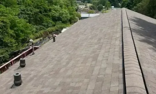 Roofing gallery displaying a newly installed asphalt shingle roof by Daniel Hood Roofing.