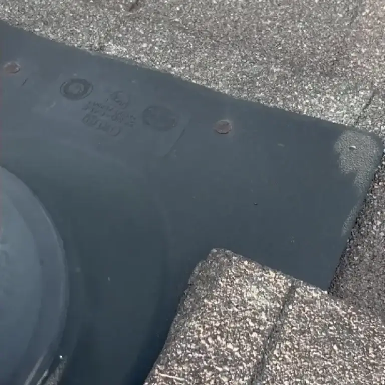 Rusted nail and deteriorating pipe boot on asphalt shingle roof requiring replacement to prevent leaks in Corryton, TN.