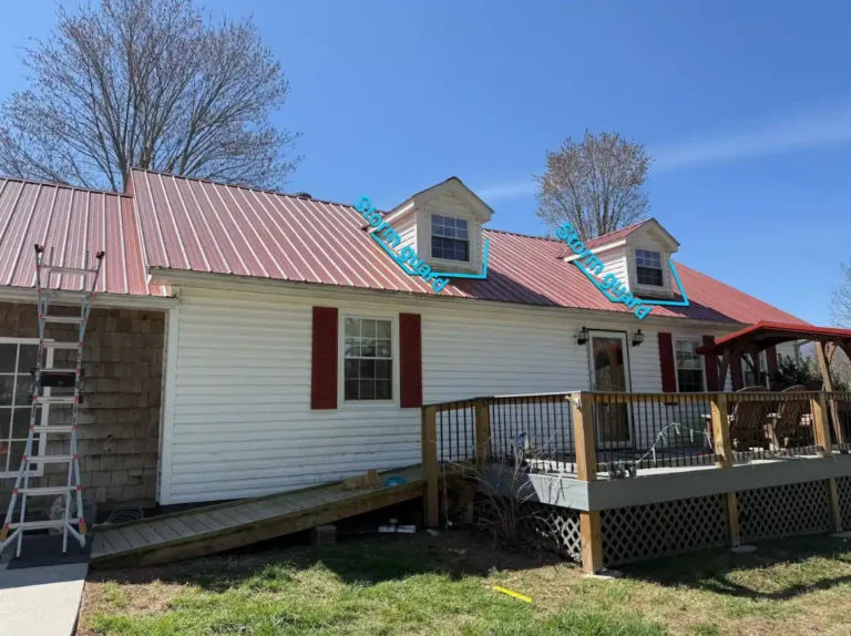 Dormer valleys on an existing metal roof marked for StormGuard waterproofing during a roof inspection in Caryville, TN.