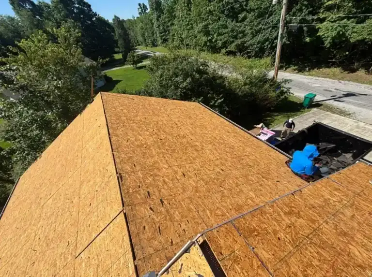 Wide view of new roof sheathing installed across a residential roof before shingle installation in Crossville, TN.